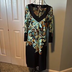 Polyester and spandex dress in greens, aqua, black and brown.